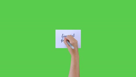 Woman-Writing-Financial-Planning-In-Cursive-on-Paper-with-Green-Screen
