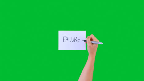 Woman-Writing-Failure-on-Paper-with-Green-Screen-01