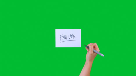 Woman-Writing-Failure-on-Paper-with-Green-Screen-02