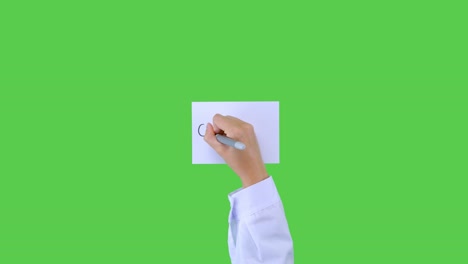 Doctor-Writing-Covid-19-on-Paper-with-Green-Screen