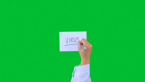 Doctor-Writing-Virus-on-Paper-with-Green-Screen-02