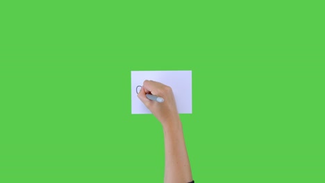 Woman-Writing-Quarantine-on-Paper-with-Green-Screen-01