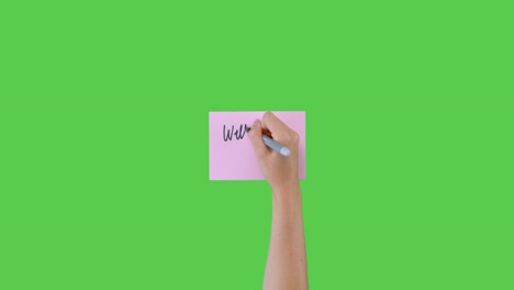 Woman-Writing-Will-You-Marry-Me-on-Paper-with-Green-Screen