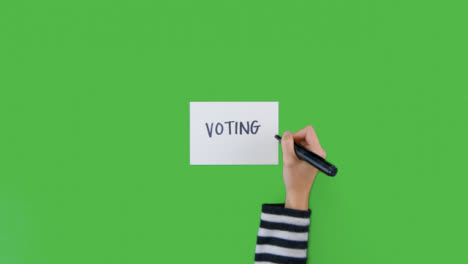 Woman-Writing-Voting-on-Paper-with-Green-Screen