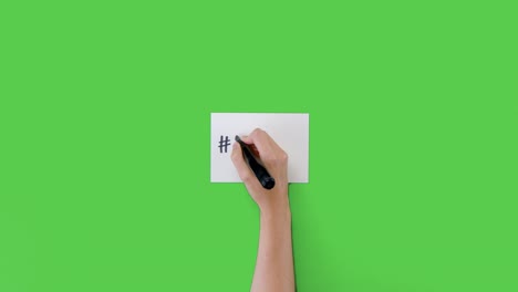 Woman-Writing-Fake-News-on-Paper-with-Green-Screen