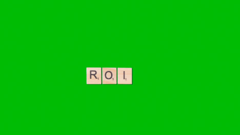 Stop-Motion-Business-Concept-Overhead-Shot-Wooden-Letter-Tiles-Forming-Acronym-ROI-On-Green-Screen
