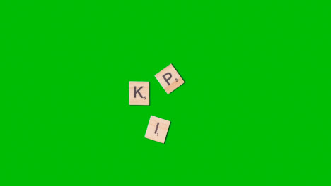 Stop-Motion-Business-Concept-Overhead-Shot-Wooden-Letter-Tiles-Forming-Acronym-KPI-On-Green-Screen