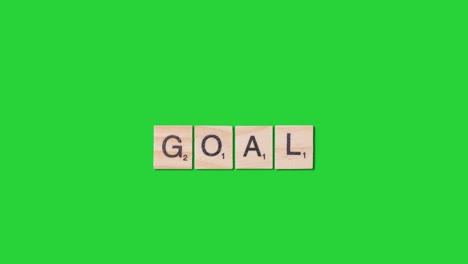 Stop-Motion-Business-Concept-Overhead-Wooden-Letter-Tiles-Forming-Word-Goal-On-Green-Screen-1