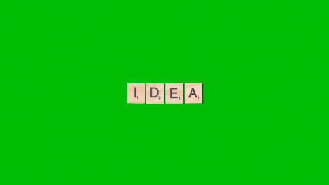 Stop-Motion-Business-Concept-Overhead-Wooden-Letter-Tiles-Forming-Word-Idea-On-Green-Screen
