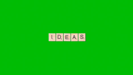 Stop-Motion-Business-Concept-Overhead-Wooden-Letter-Tiles-Forming-Word-Ideas-On-Green-Screen-1