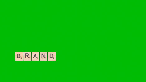 Stop-Motion-Business-Concept-Overhead-Wooden-Letter-Tiles-Forming-Word-Brand-On-Green-Screen-1