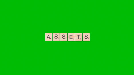 Stop-Motion-Business-Concept-Overhead-Wooden-Letter-Tiles-Forming-Word-Assets-On-Green-Screen