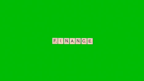 Stop-Motion-Business-Concept-Overhead-Wooden-Letter-Tiles-Forming-Word-Finance-On-Green-Screen