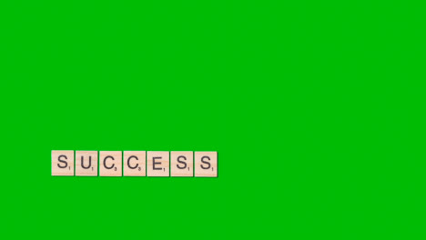 Stop-Motion-Business-Concept-Overhead-Wooden-Letter-Tiles-Forming-Word-Success-On-Green-Screen-1