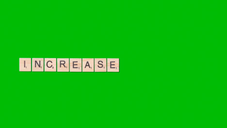 Stop-Motion-Business-Concept-Overhead-Wooden-Letter-Tiles-Forming-Word-Increase-On-Green-Screen-1