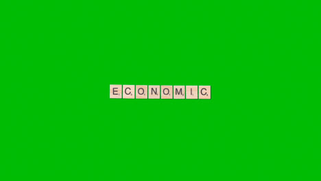 Stop-Motion-Business-Concept-Overhead-Wooden-Letter-Tiles-Forming-Word-Economic-On-Green-Screen