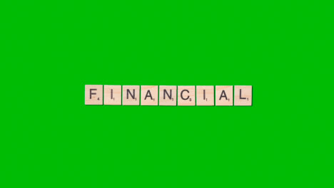 Stop-Motion-Business-Concept-Overhead-Wooden-Letter-Tiles-Forming-Word-Financial-On-Green-Screen-1