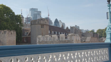 From-Tower-Bridge-To-Exterior-Of-The-Tower-Of-London-With-Modern-City-Skyline-Behind-England-UK