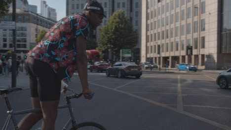 Busy-Road-Traffic-Junction-In-London-With-Cyclists-Cars-And-Pedestrians