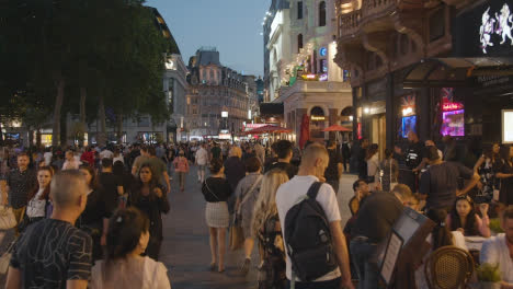 Crowd-Of-Summer-Tourists-Walking-In-Leicester-Square-At-Dusk-In-London-England-UK-6