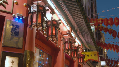 Close-Up-Of-Lanterns-Outside-Restaurant-In-Gerrard-Street-In-Chinatown-At-Dusk-In-London-England-UK