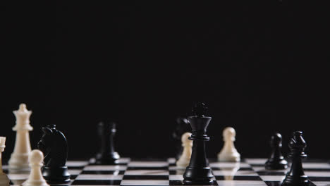 Studio-Shot-Chess-Board-And-Pieces-Set-Up-For-Game-With-Black-King-Taking-White-Rook