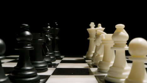 Studio-Shot-Chess-Board-With-Black-And-White-Pieces-Facing-Each-Other