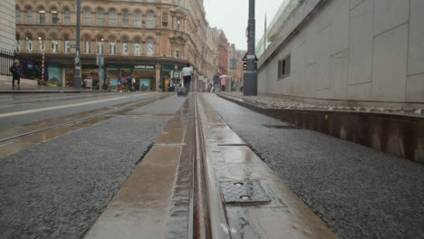 Tram-Lines-In-Front-Of-The-Grand-Central-Shopping-Centre-In-Birmingham-UK-On-Rainy-Day-3