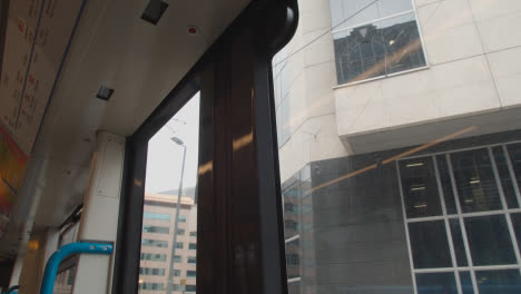 View-From-Inside-Tram-Through-Window-Of-Office-Buildings-In-Birmingham-UK