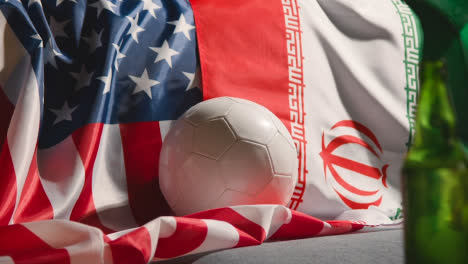 Sofa-In-Lounge-With-Iranian-And-American-Flags-And-Ball-As-Fans-Watch-Football-Soccer-Match-On-TV-3