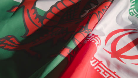Studio-Still-Life-Shot-Of-Welsh-And-Iranian-Flags-From-Soccer-World-Cup-Group-Stage-Teams-2022