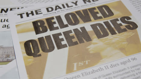 Tracking-Close-Up-of-Newspaper-Headlines-of-Queen-Elizabeths-Death-02