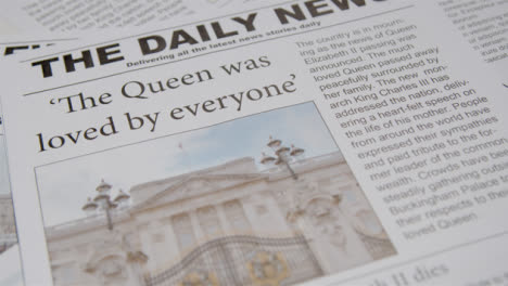 Tracking-Close-Up-of-Newspaper-Headlines-of-Queen-Elizabeths-Death-03