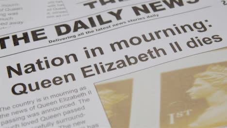 Tracking-Close-Up-of-Newspaper-Headlines-of-Queen-Elizabeths-Death-06