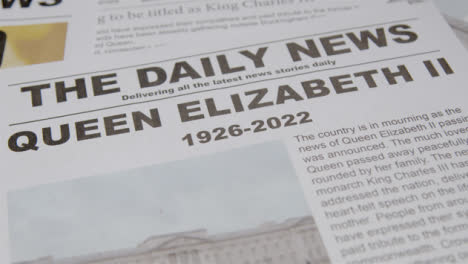 Tracking-Close-Up-of-Newspaper-Headlines-of-Queen-Elizabeths-Death-07