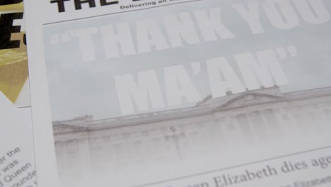 Tracking-Close-Up-of-Newspaper-Headlines-of-Queen-Elizabeths-Death-08