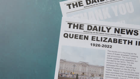 Tracking-Shot-of-Queen-Elizabeth-Death-Newspaper-Headlines-with-Copy-Space-03
