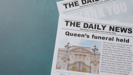 Tracking-Shot-of-Queen-Elizabeth-Death-Newspaper-Headlines-with-Copy-Space-08