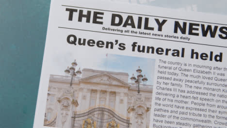 Tracking-Shot-of-Queen-Elizabeth-Death-Newspaper-Headlines-with-Copy-Space-09