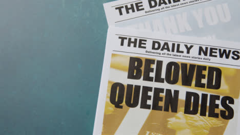 Tracking-Shot-of-Queen-Elizabeth-Death-Newspaper-Headlines-with-Copy-Space-10