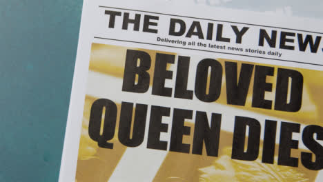 Tracking-Shot-of-Queen-Elizabeth-Death-Newspaper-Headlines-with-Copy-Space-11