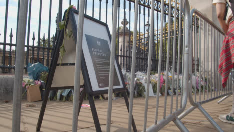 Low-Angle-Shot-of-Flowers-Laid-In-Tribute-Outside-Buckingham-Palace