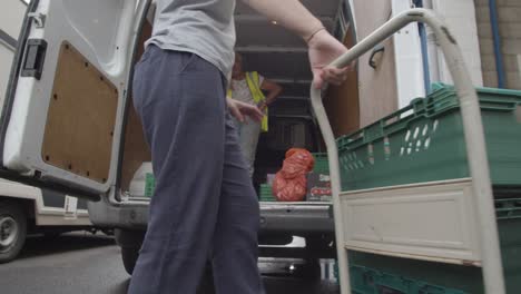 Loading-Bay-Of-UK-Food-Bank-Building-With-Food-Being-Loaded-Into-Vans-7