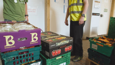 Interior-Of-UK-Food-Bank-Building-With-Fresh-Food-Being-Sorted-For-Delivery-9