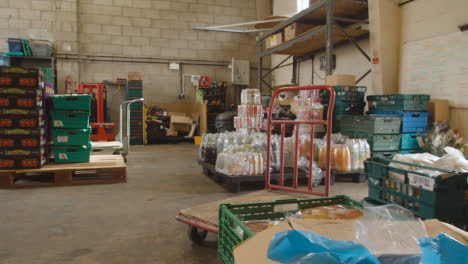 Interior-Of-UK-Food-Bank-Building-With-Fresh-Food-Being-Sorted-For-Delivery-16