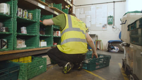 Interior-Of-UK-Food-Bank-Building-With-Food-Being-Sorted-For-Delivery