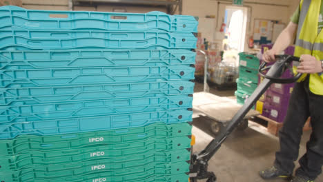 Interior-Of-UK-Food-Bank-Building-With-Plastic-Storage-Trays-Being-Sorted-For-Deliveries