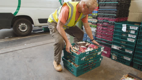 Loading-Bay-Of-UK-Food-Bank-Building-With-Food-Being-Loaded-Into-Vans-9