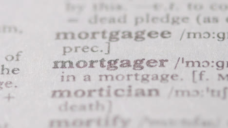 Close-Up-On-Page-Of-Dictionary-With-Definition-Of-Word-Mortgager