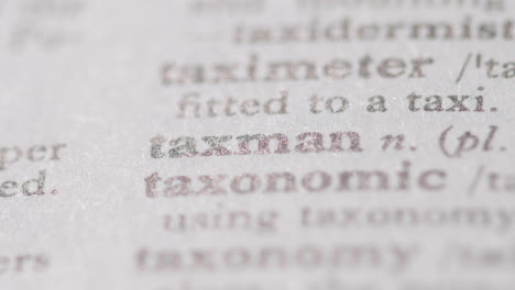 Close-Up-On-Page-Of-Dictionary-With-Definition-Of-Word-Taxman-1